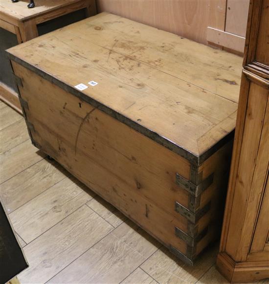 A large metal bound pine chest W.102cm